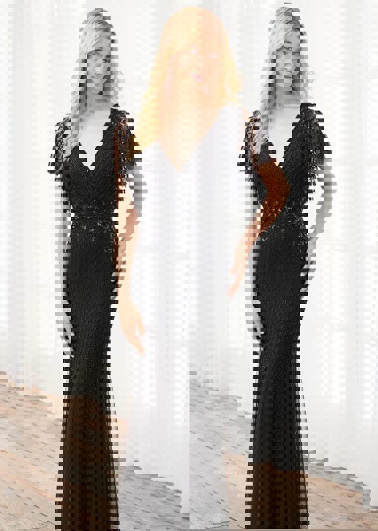 Model wearing a black dress