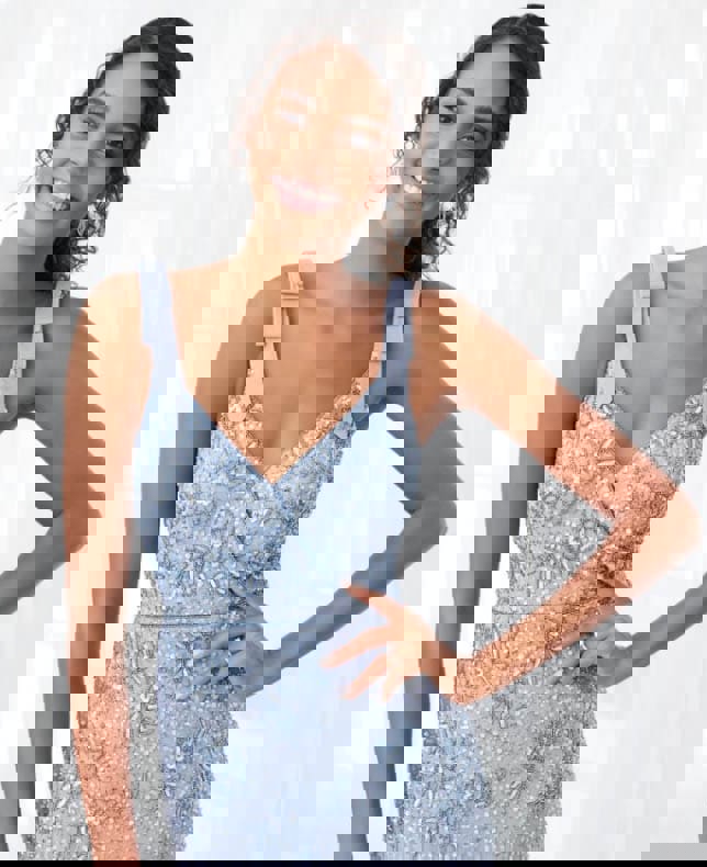 Model wearing a blue dress