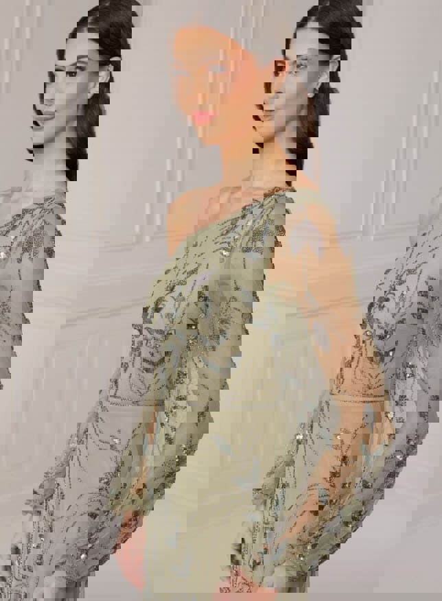 Model wearing a olive dress