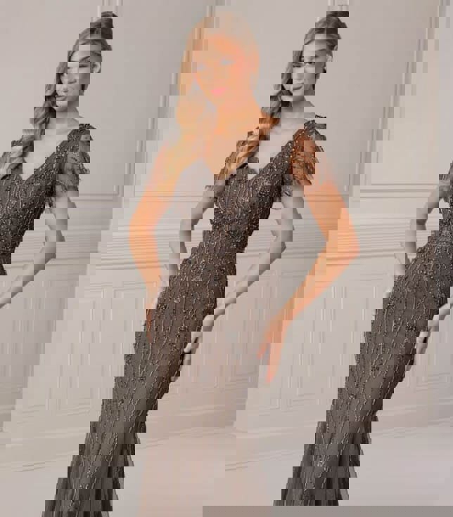 Model wearing a gray dress